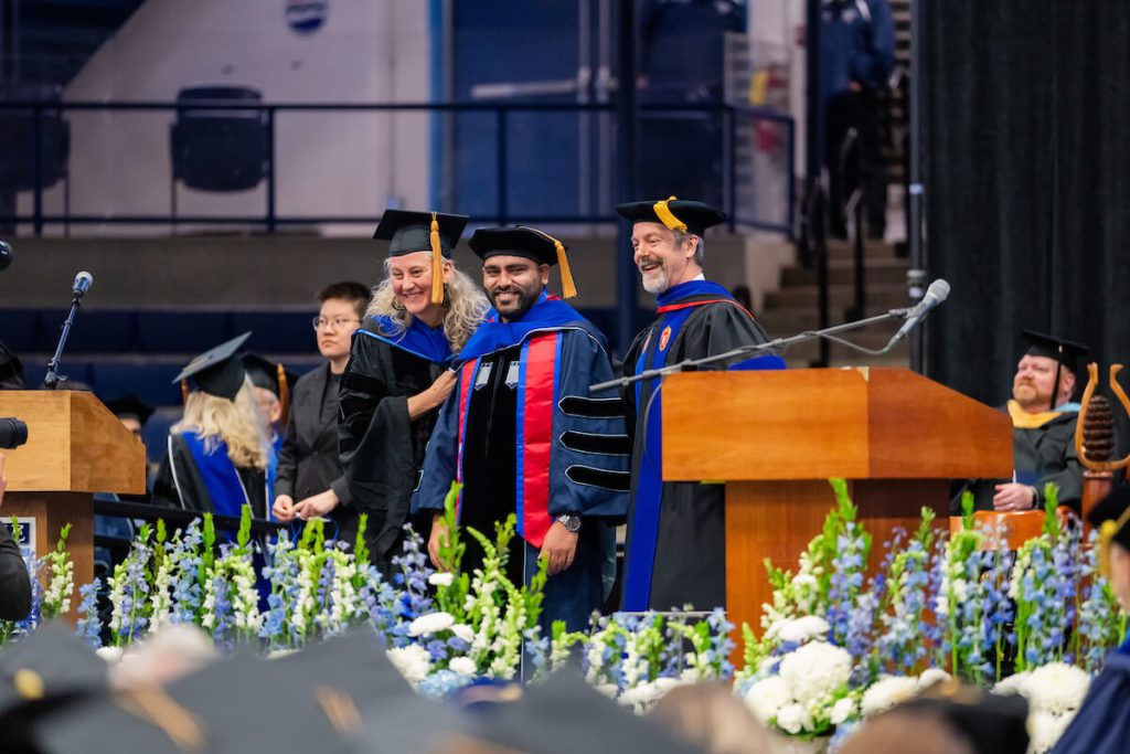 A photo of a doctoral candidate being hooded