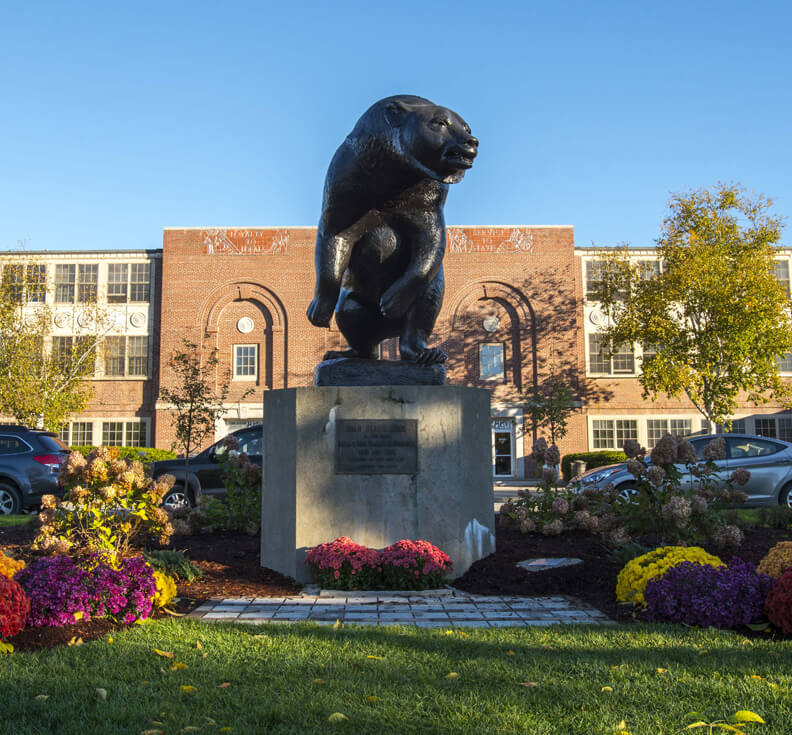 Black Bear statue in front of UMaine's New Balance Field House